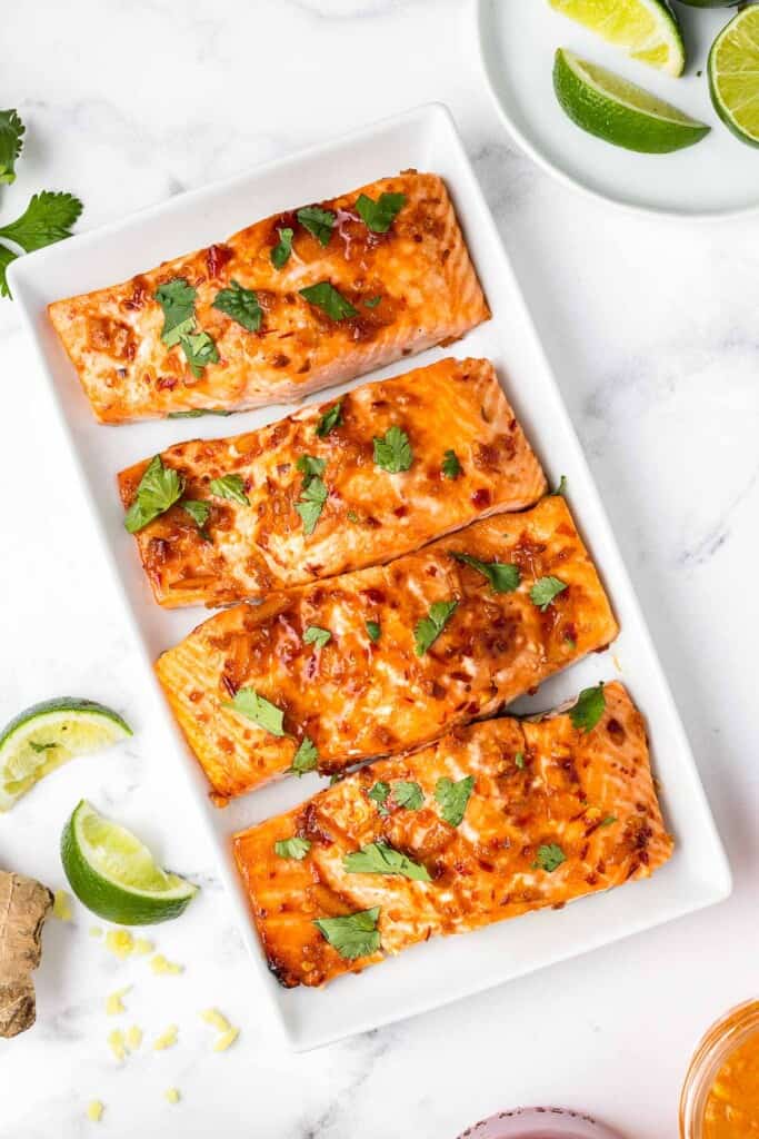 serving of baked salmon with side dishes filets