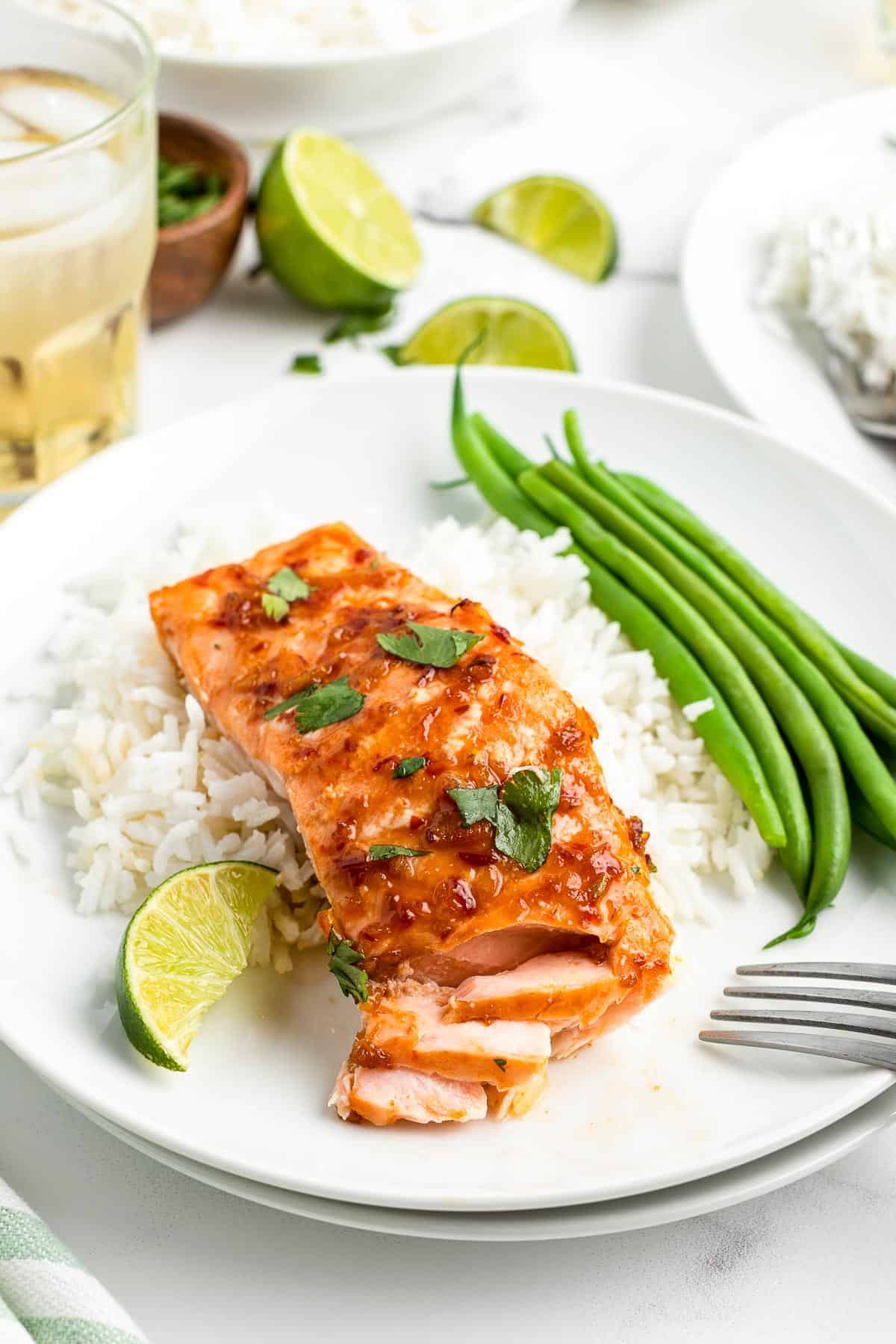 serving of baked salmon with side dishes plated