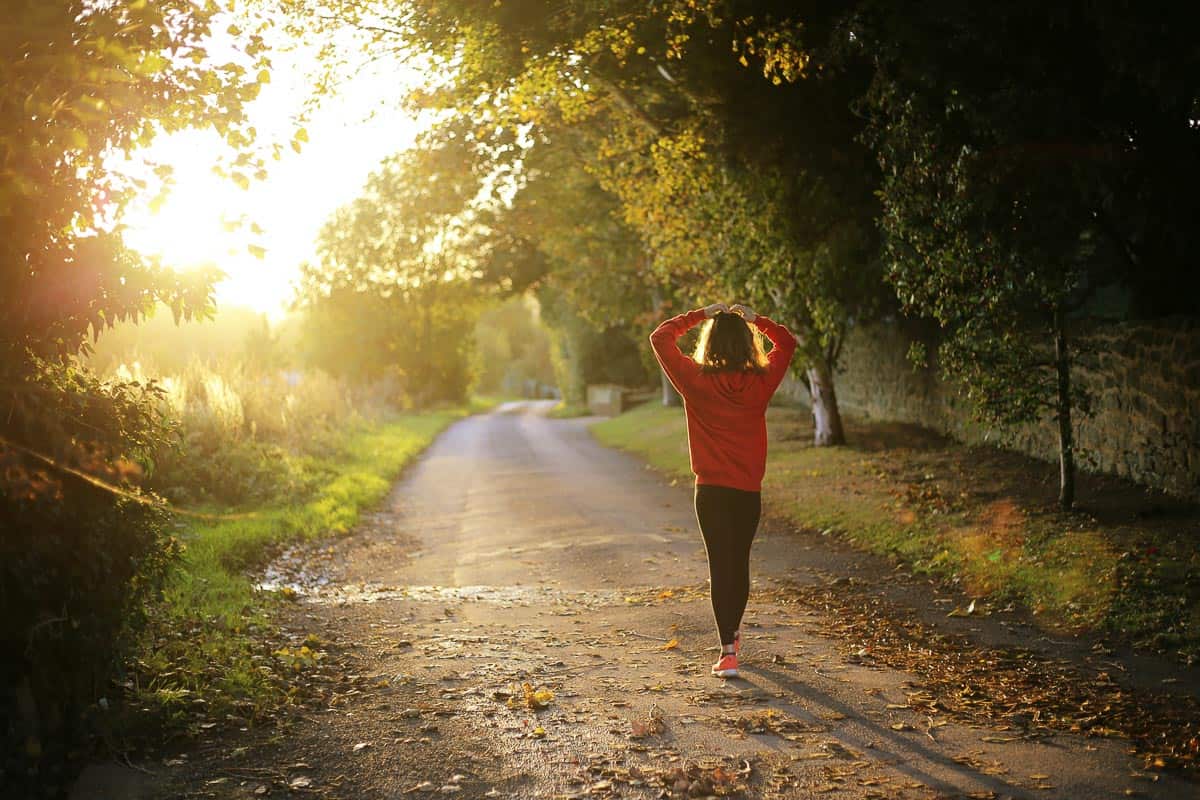 woman walking in sunlight