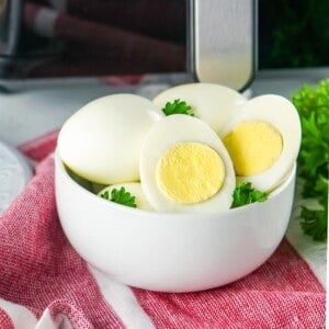 air fryer hard boiled eggs in white bowl