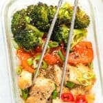 sheet pan chicken and veggies in glass container