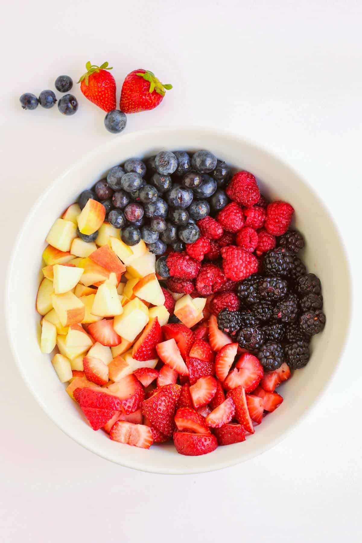 red white and blue fruit salad in bowl pre-mixed.