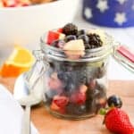 red white and blue fruit salad in jar.