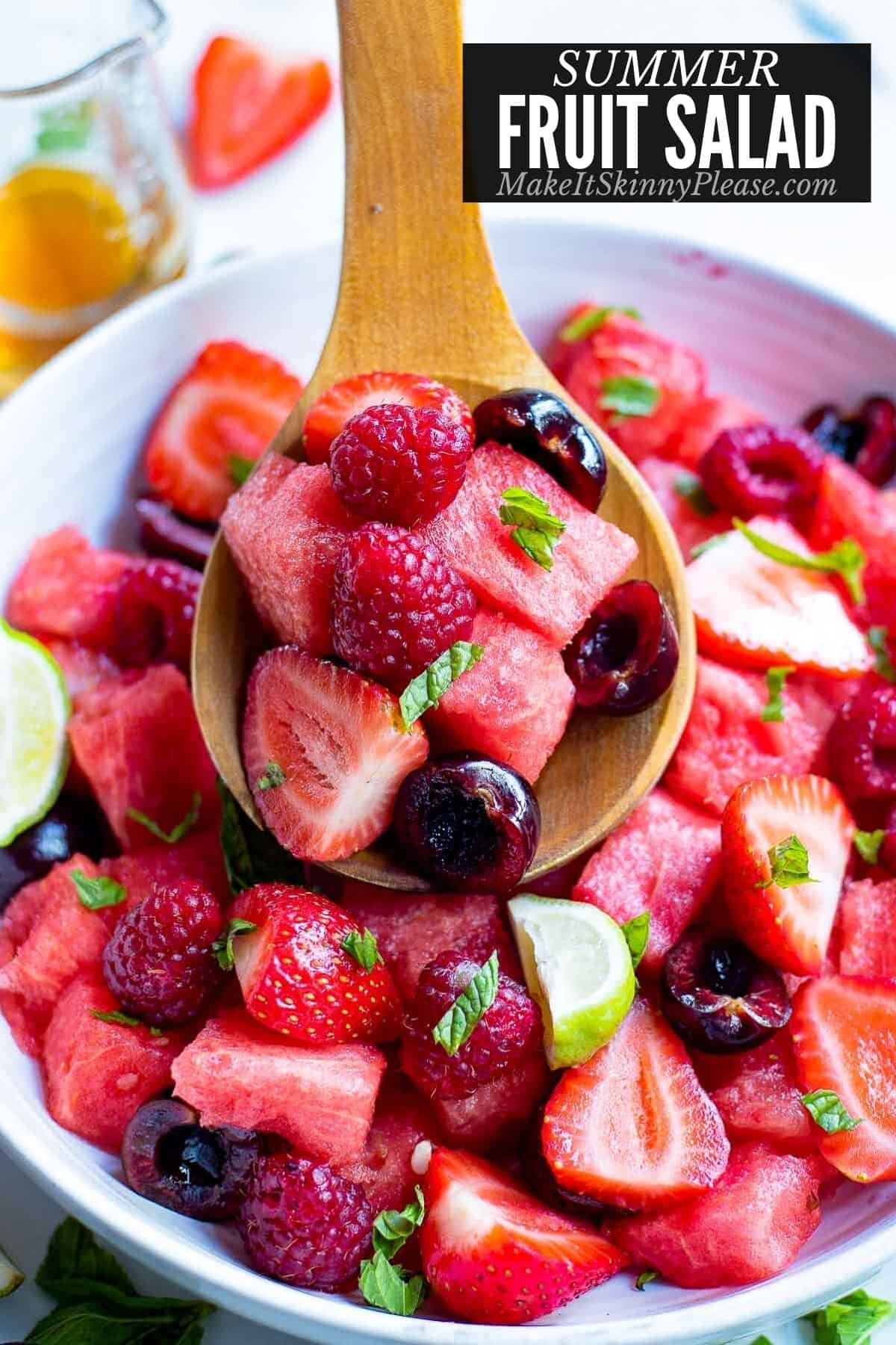 summer fruit salad with serving spoonful