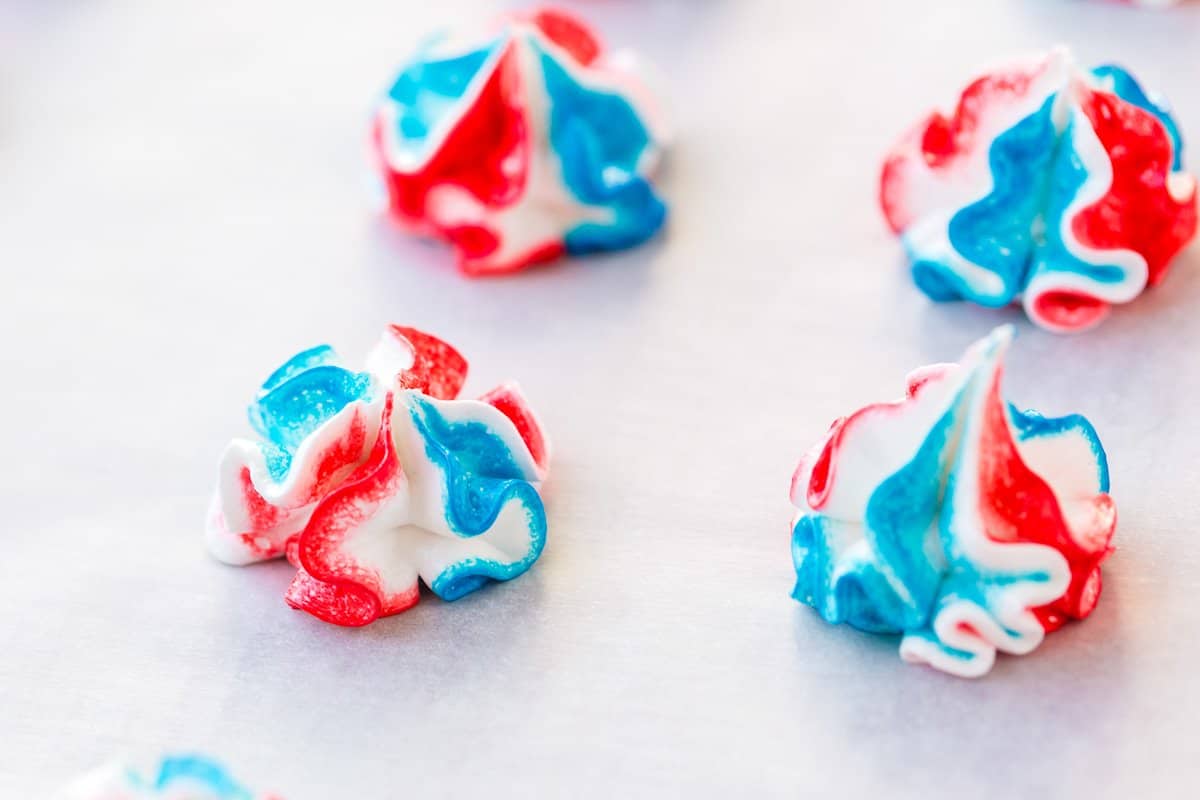 4th of july meringue cookies on parchment paper.