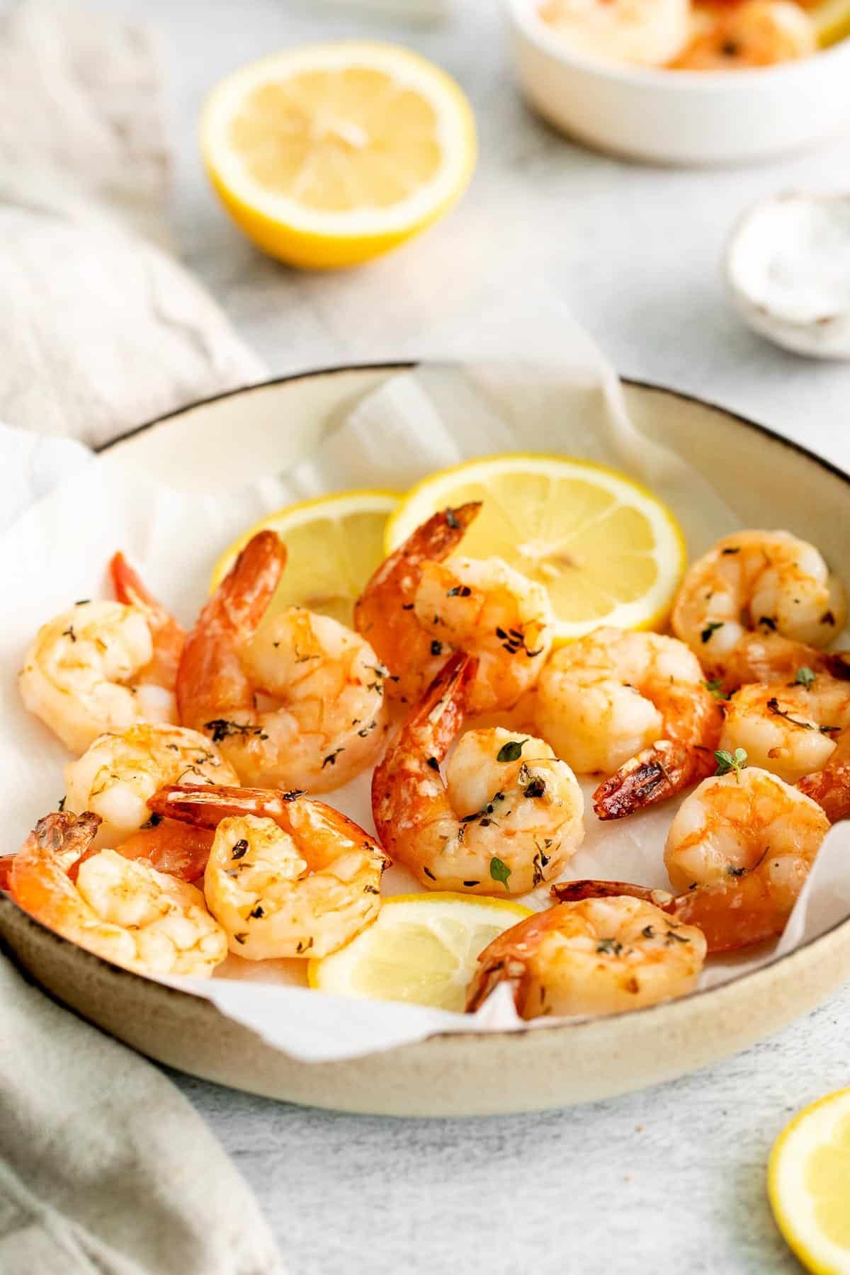air fryer shrimp in bowl from side.