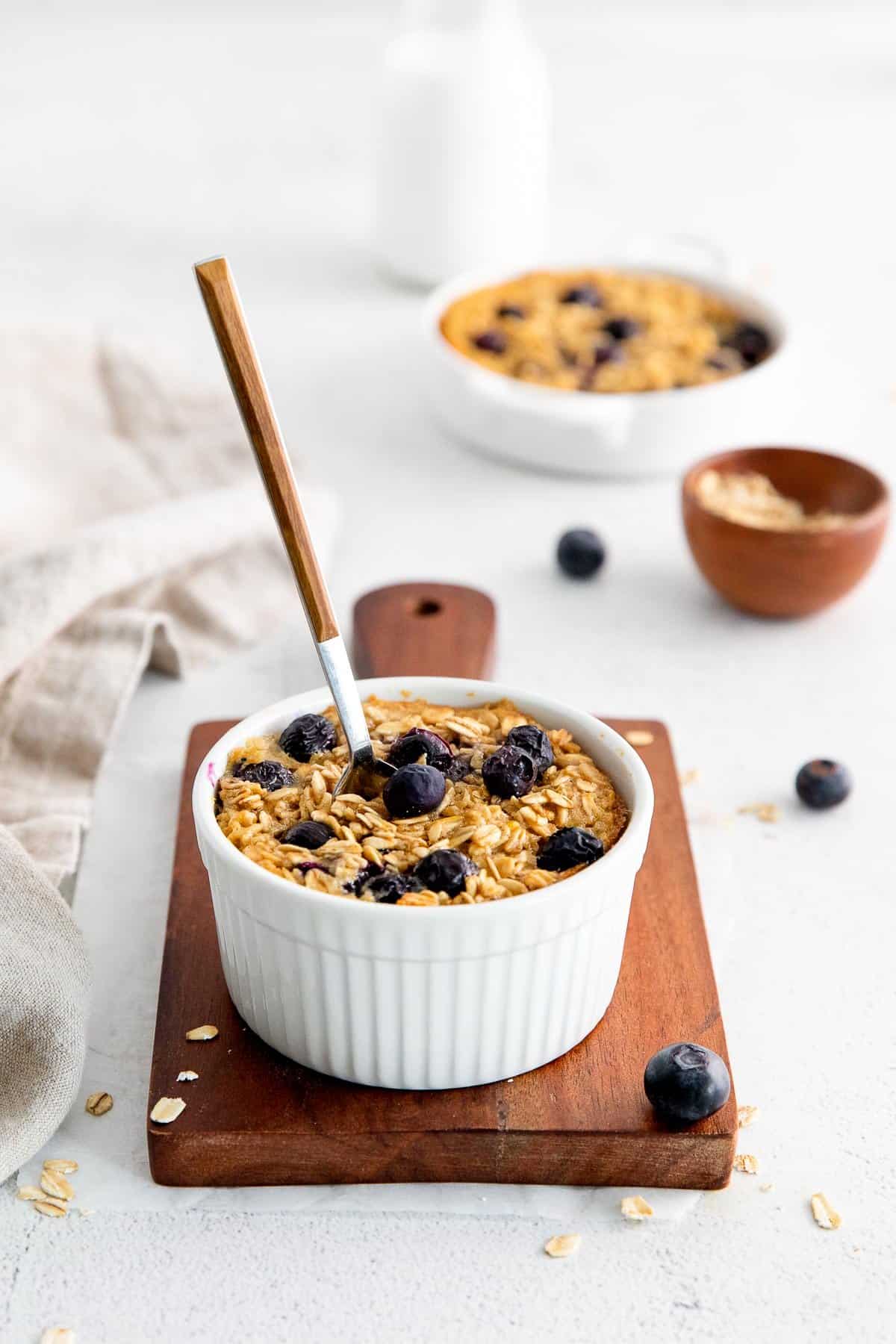 blueberry baked oatmeal cups with spoon.