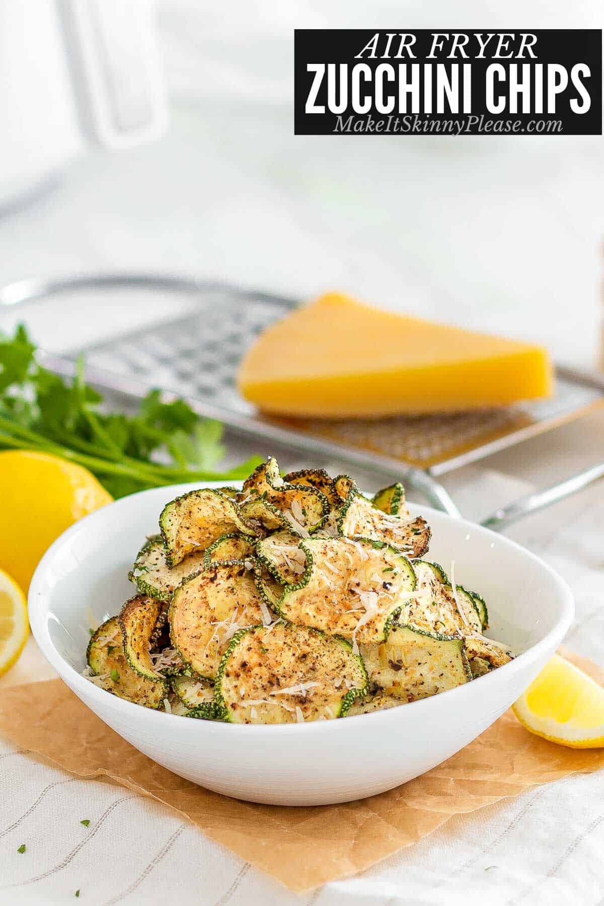 air fryer zucchini chips in white bowl.