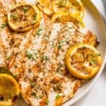 grilled lemon pepper chicken on a plate.