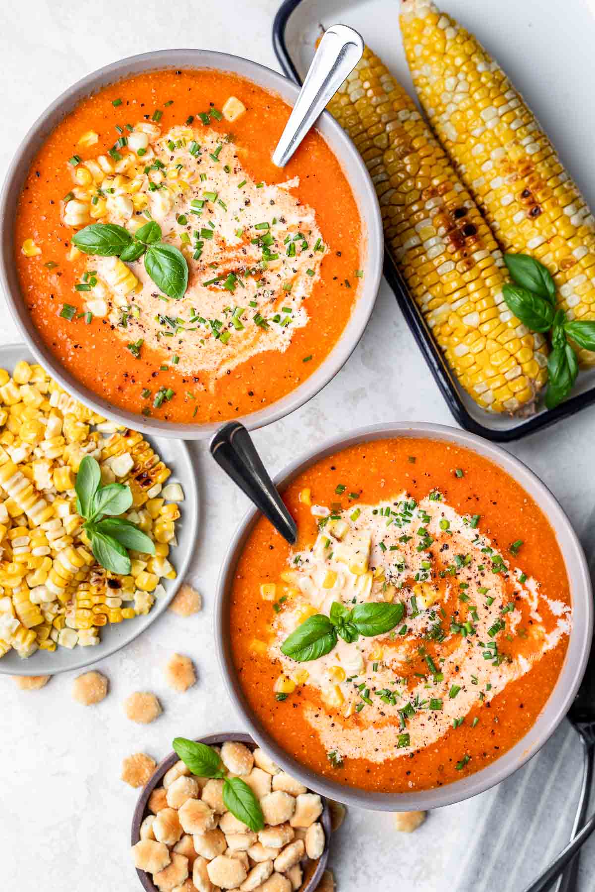 tomato and sweet corn soup in two bowls.