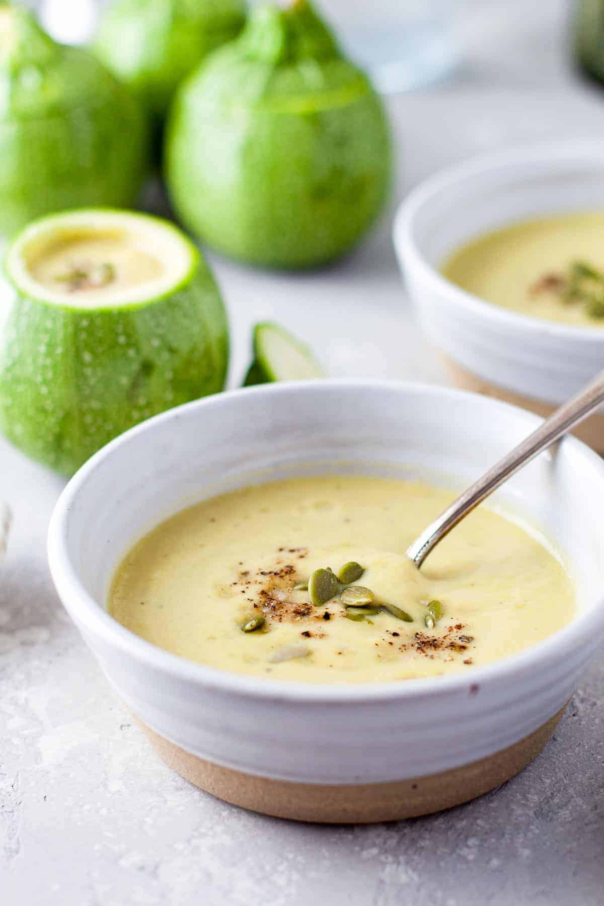 zucchini soup in bowl side angle e