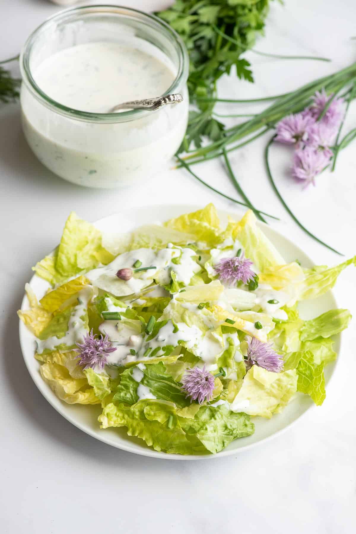 low calorie ranch dressing on fresh green salad.