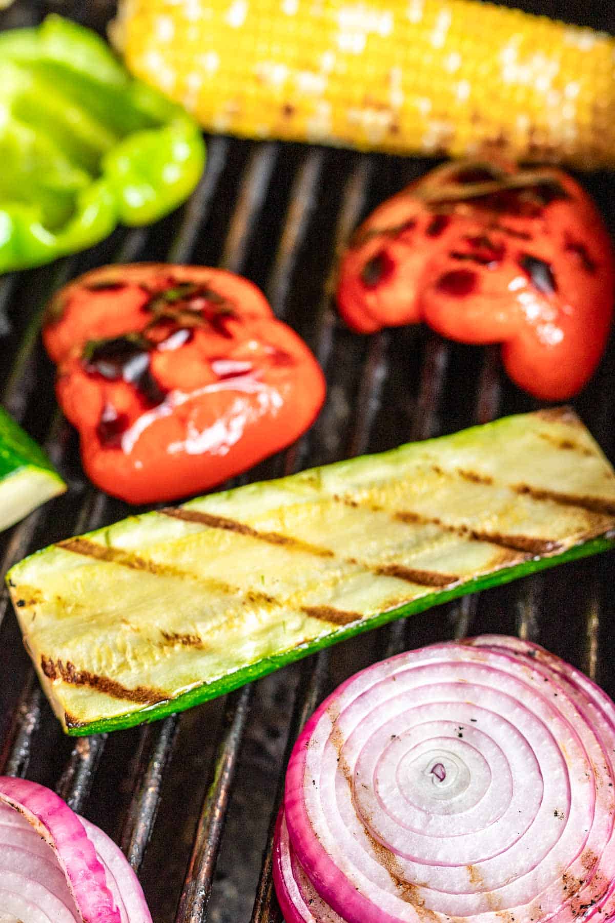 vegetables on grill with grill marks.