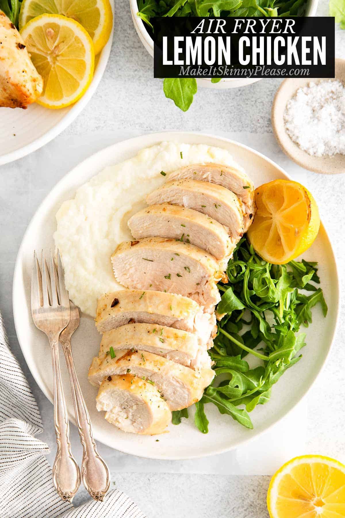 air fryer lemon chicken on plates with side dishes.