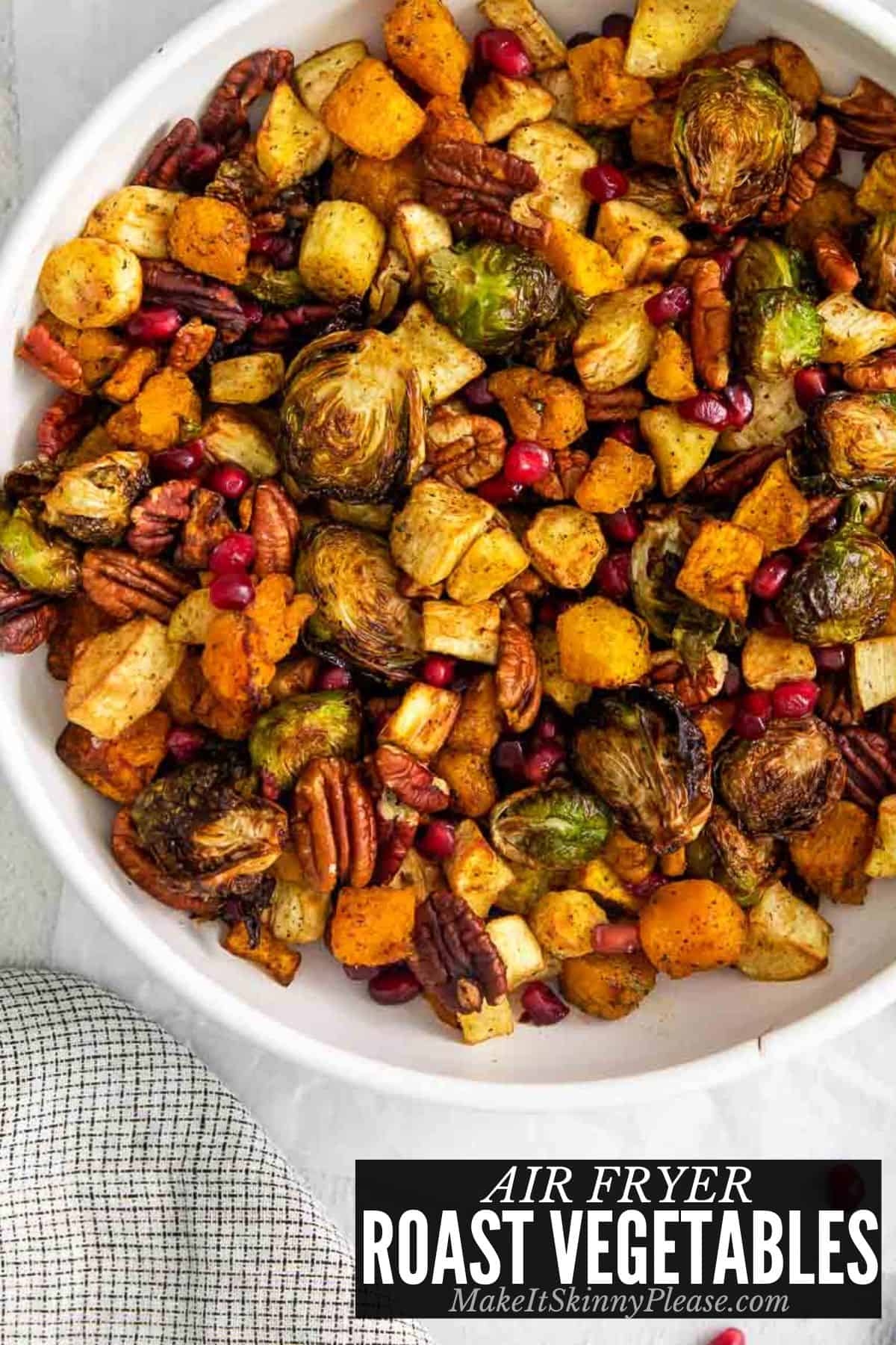 air fryer roast vegetables with pecans and pomegranate seeds.