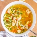 bowl of chicken zoodle soup crop.
