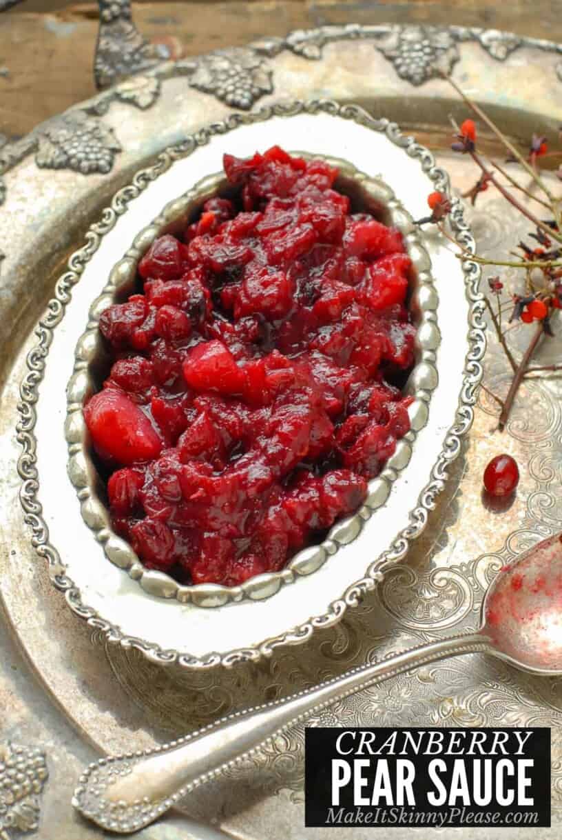 cranberry pear sauce in a silver serving bowl with spoon.