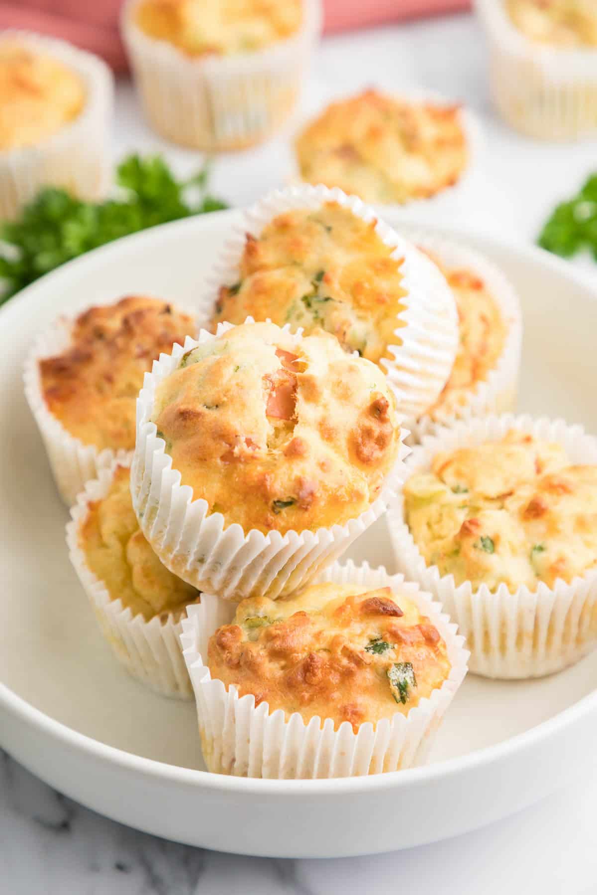 ham and cheese muffins on plate.