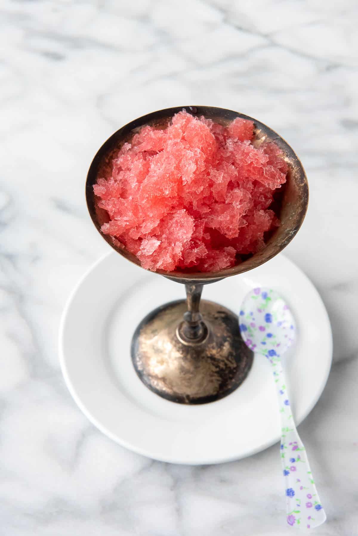 pink champagne granita in glass with spoon