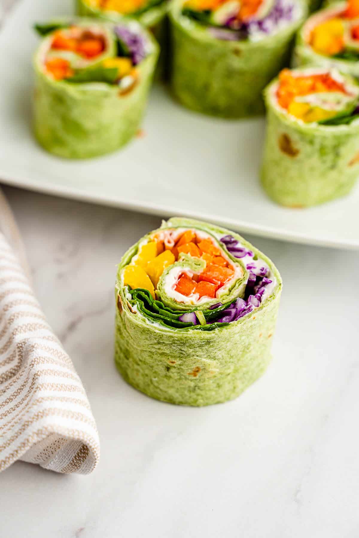 turkey roll ups from above on platter with single rollup.