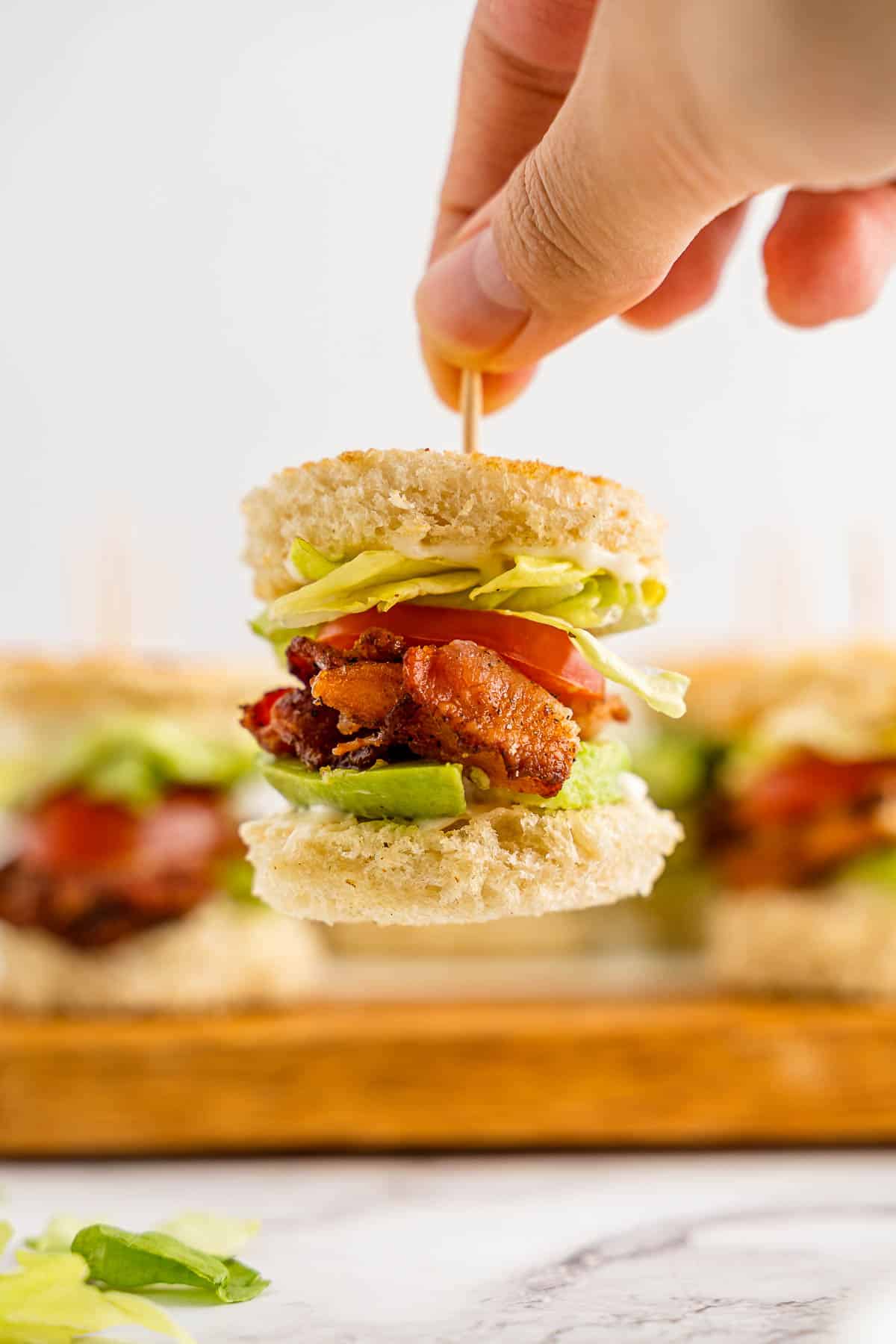 mini BLT sandwiches close up with toothpick.