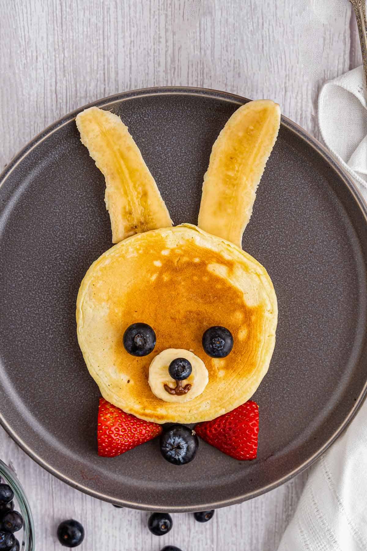 bunny pancake on gray plate from above.