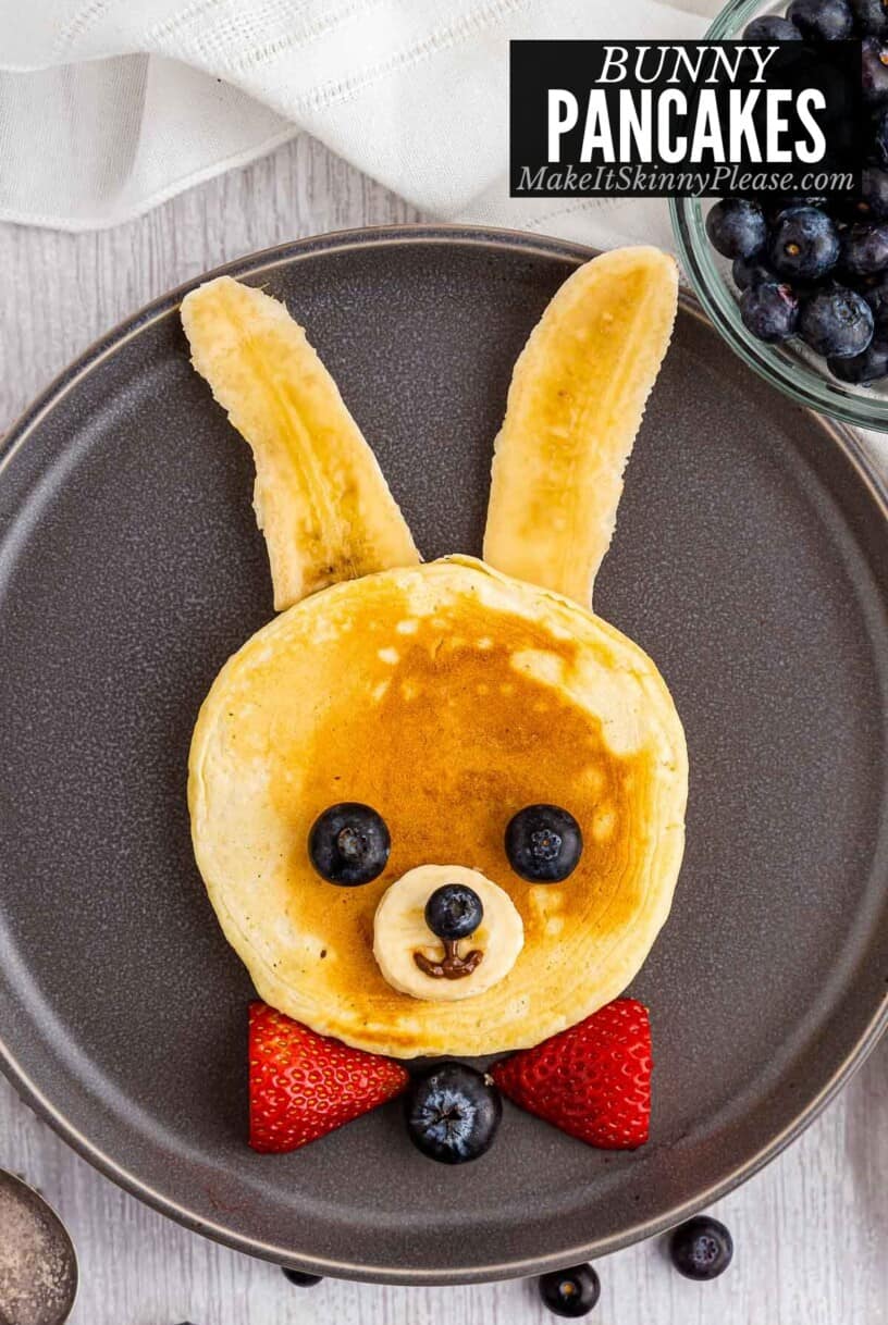 bunny pancakes on gray plate with blueberries.