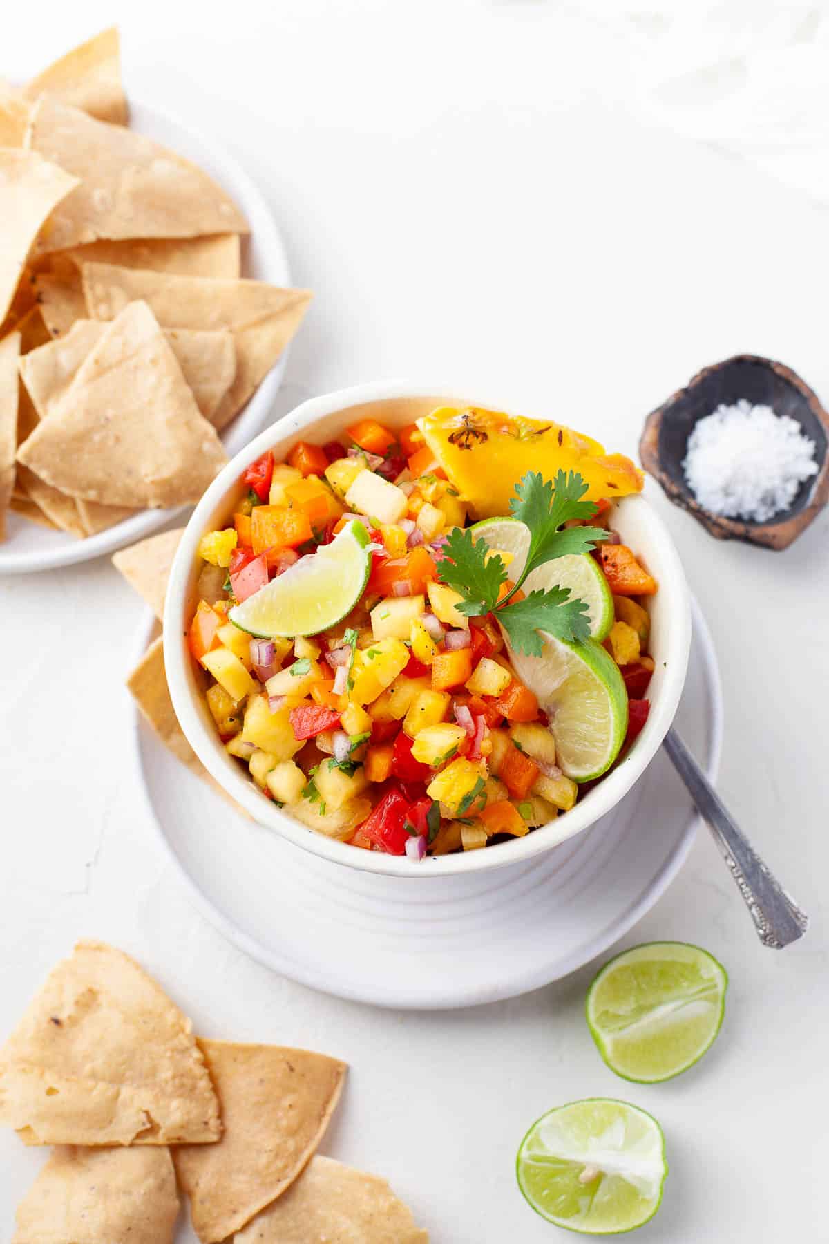 pineapple pico de gallo in bowl with chips 