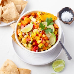 pineapple pico de gallo in bowl with chips