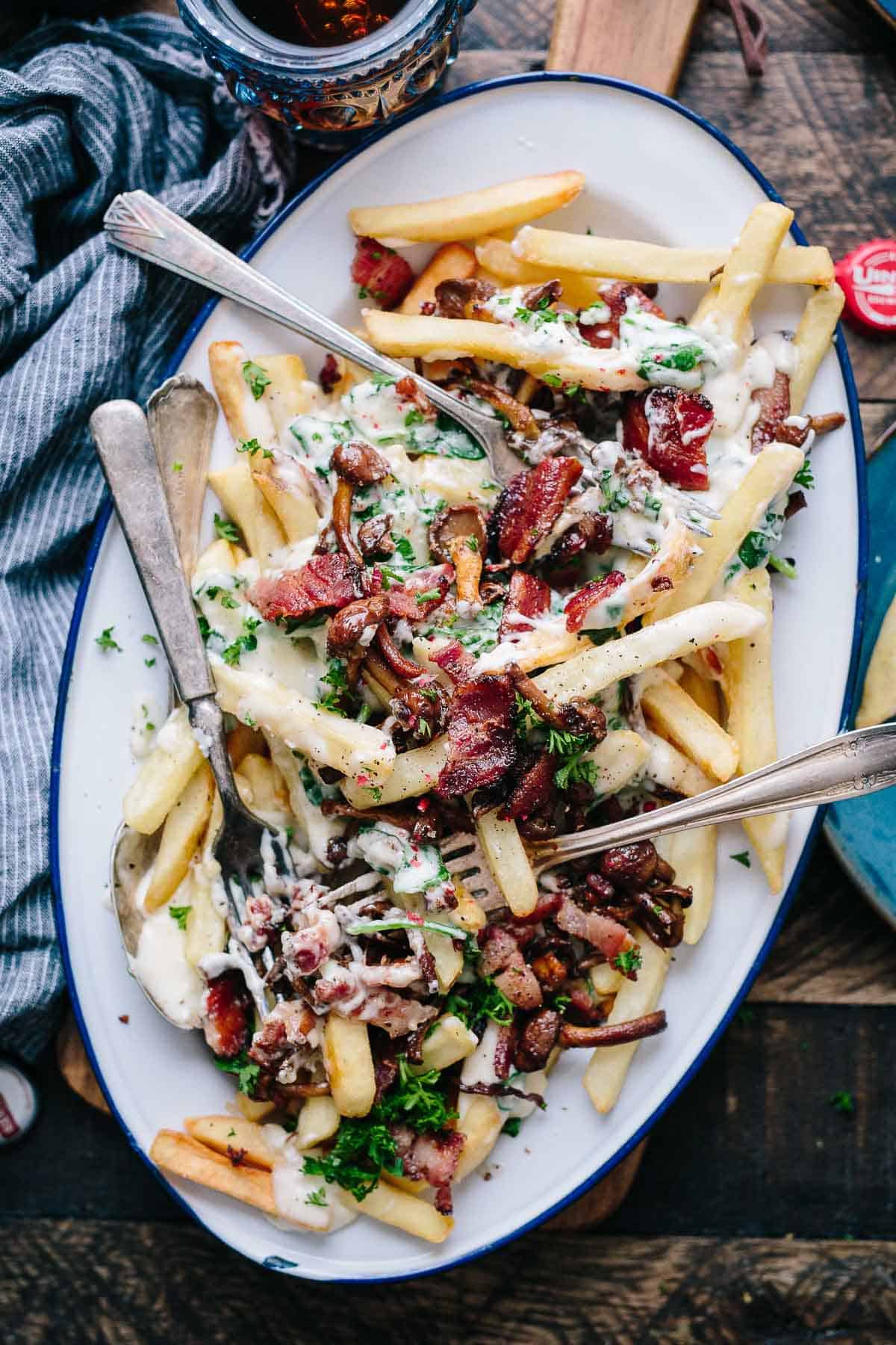 fries with dressing and bacon on platter