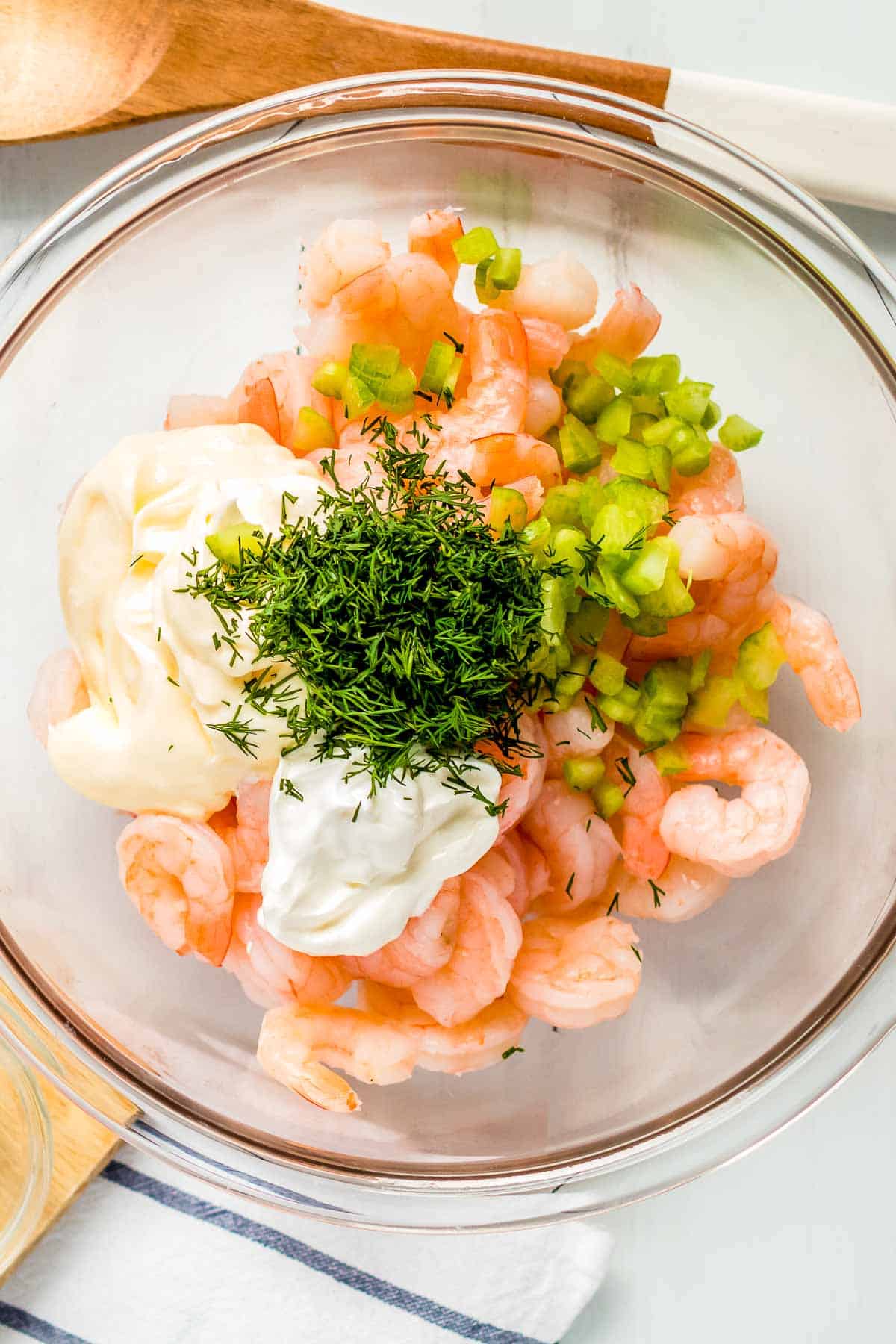 shrimp salad ingredients in bowl.