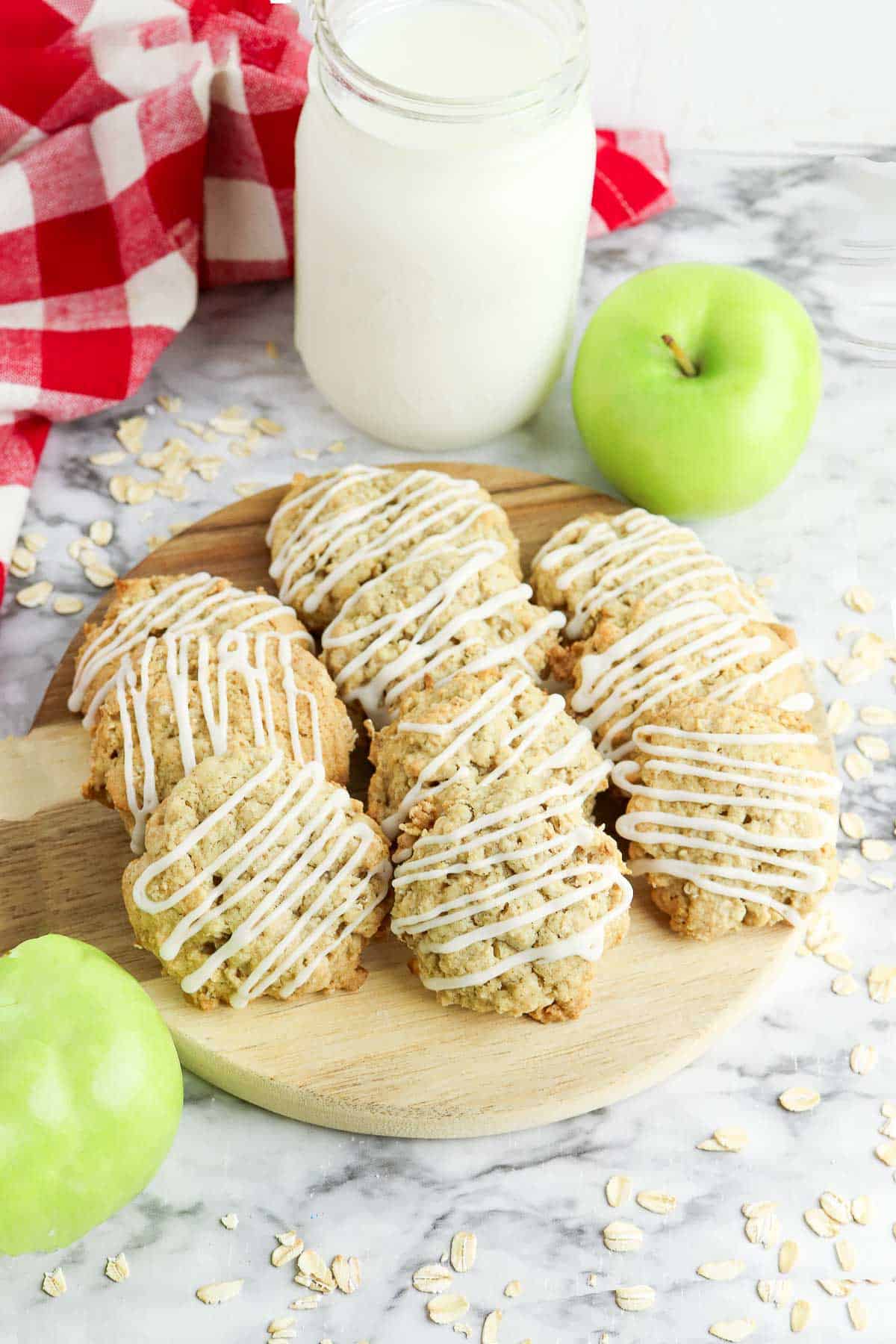 oatmeal apple cookies on cutting board.