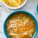instant pot chicken soup in blue bowl.