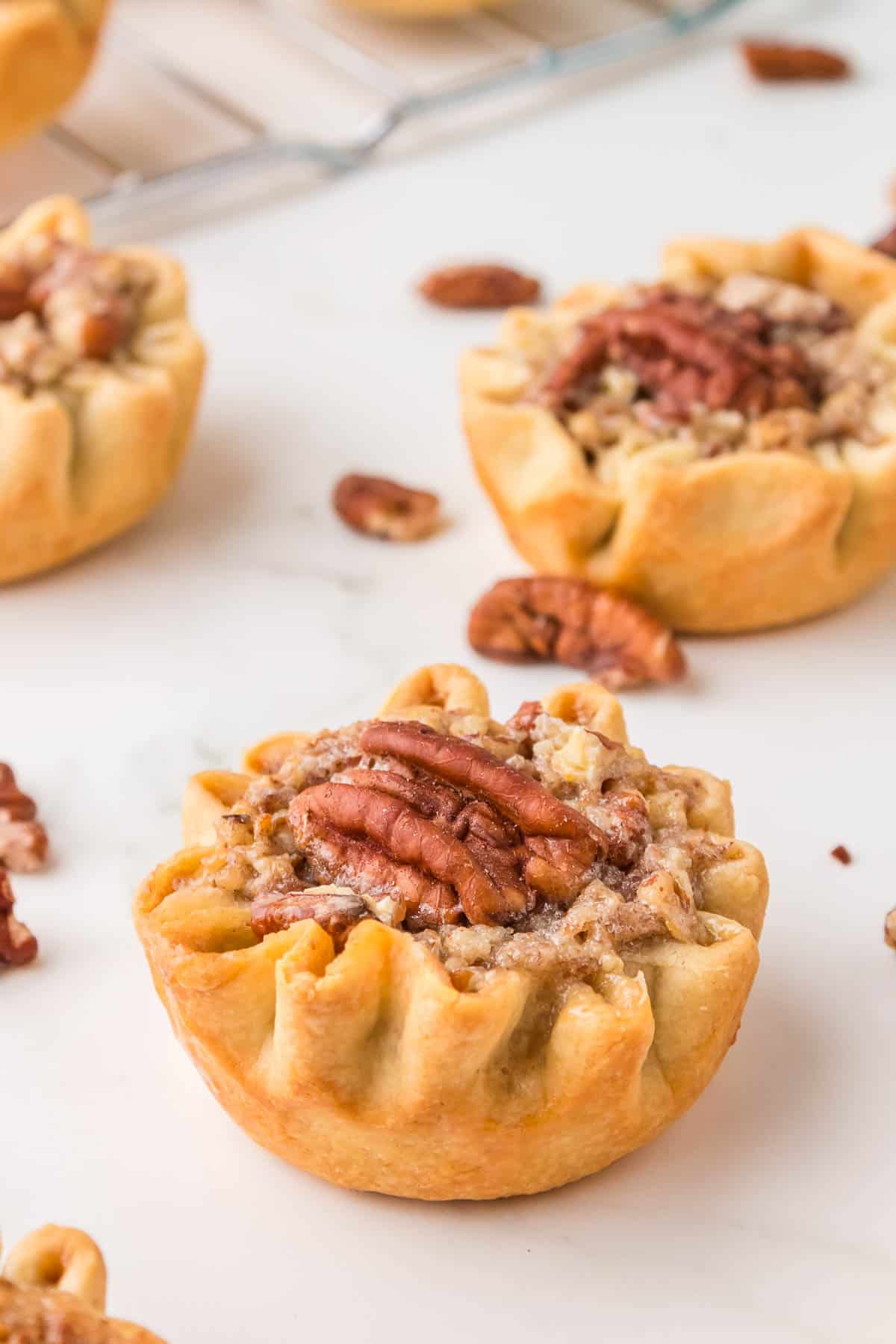mini pecan pies close up side view.