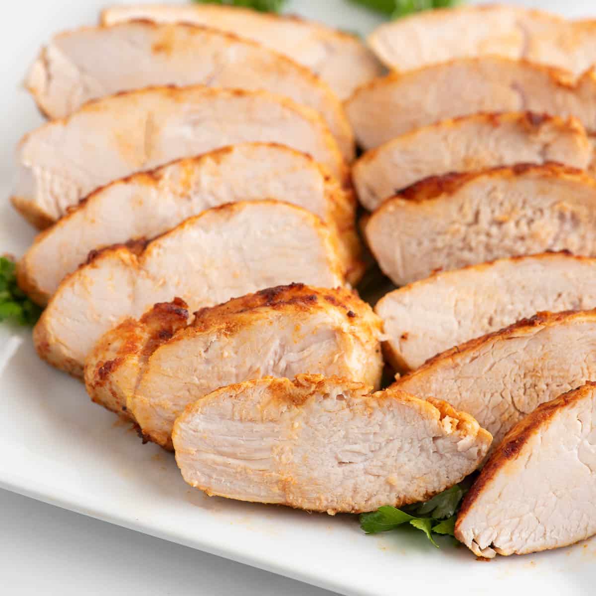 https://makeitskinnyplease.com/wp-content/uploads/2023/11/air-fryer-turkey-tenderloin-sliced-close-up.jpg