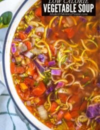 low calorie vegetable noodle soup in a pot with title overlay